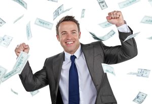 Cropped portrait of a businessman cheering as money rains down against a white background